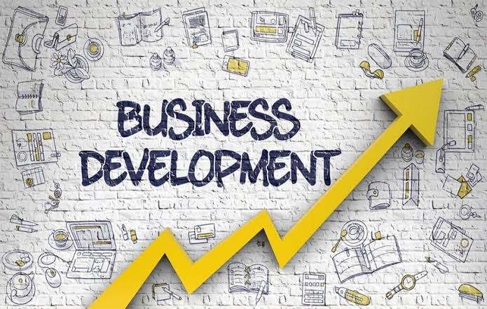 business development icons with a jagged yellow arrow going up